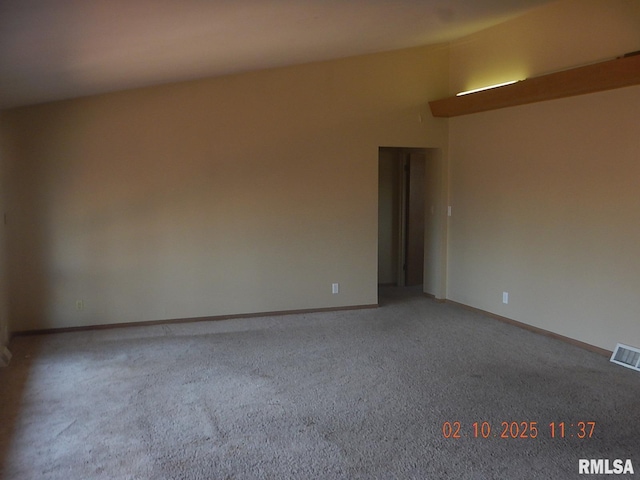 carpeted empty room featuring baseboards and visible vents