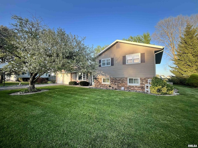 view of front of home with aphalt driveway, a garage, and a front lawn