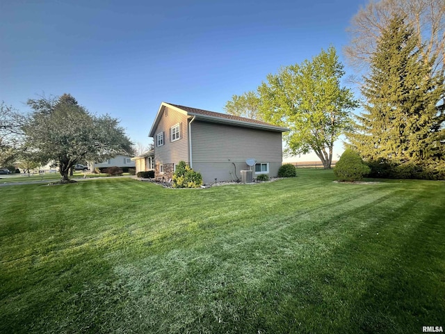 view of home's exterior featuring a lawn