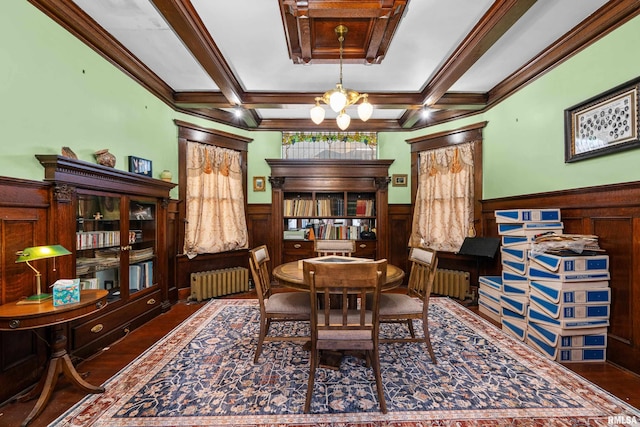 dining space featuring beamed ceiling, radiator heating unit, a chandelier, and wainscoting