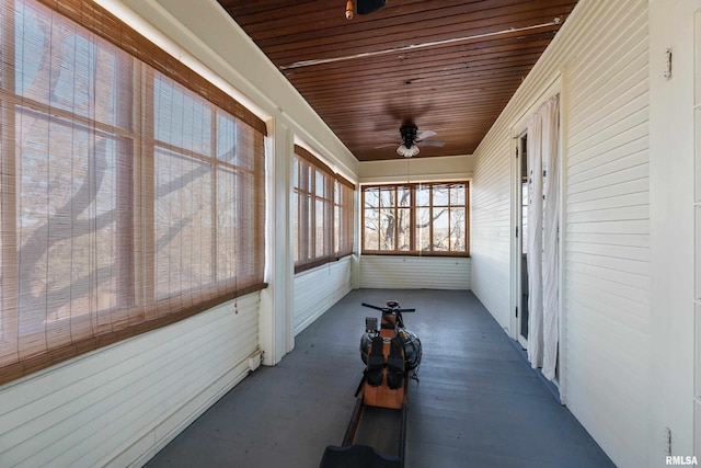 sunroom / solarium with wooden ceiling and ceiling fan