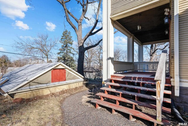 view of yard featuring covered porch