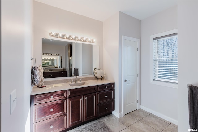 1621 S Eugene Ln, Marion, IL 62959 - bathroom with vanity, baseboards, and tile patterned flooring
