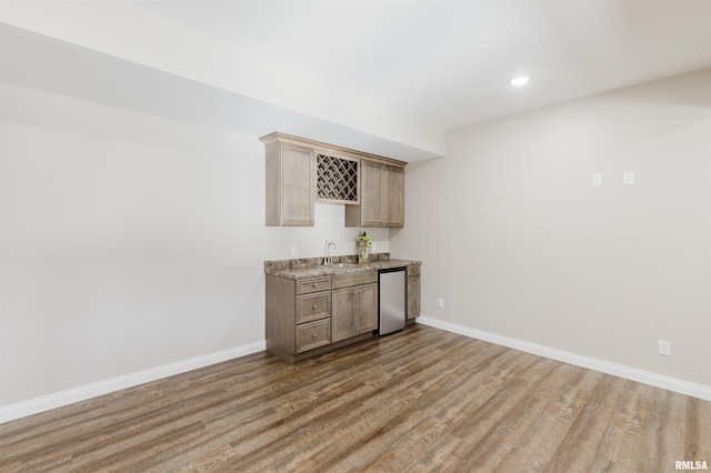 1621 S Eugene Ln, Marion, IL 62959 - bar featuring indoor wet bar, wood finished floors, baseboards, and a sink