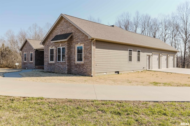 1621 S Eugene Ln, Marion, IL 62959 - view of front of property with brick siding, an attached garage, concrete driveway, and a shingled roof