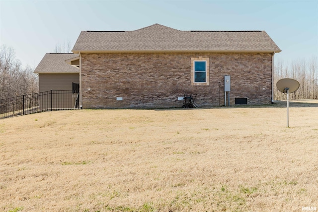 1621 S Eugene Ln, Marion, IL 62959 - view of side of home featuring brick siding, a yard, roof with shingles, and fence