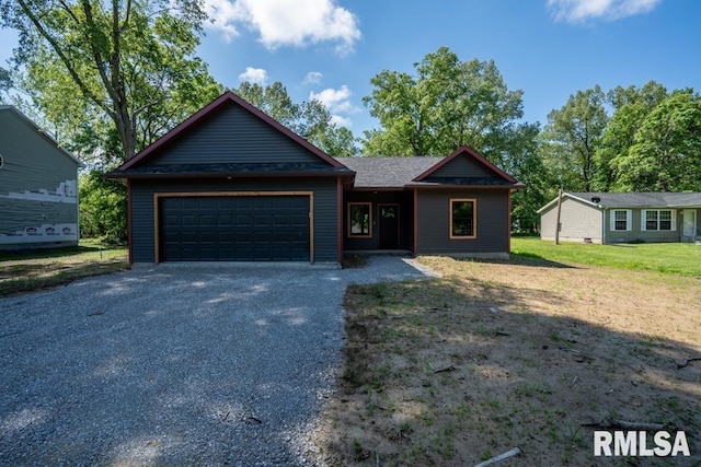 207 Rowatt St, Cambria, IL 62915 - view of front of property with a garage and gravel driveway