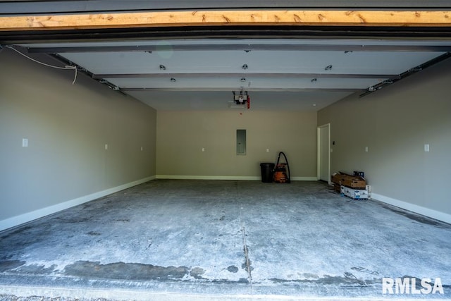 207 Rowatt St, Cambria, IL 62915 - garage featuring a garage door opener, electric panel, and baseboards