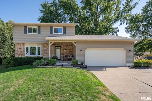 traditional-style house featuring a front yard, driveway, covered porch, a garage, and brick siding