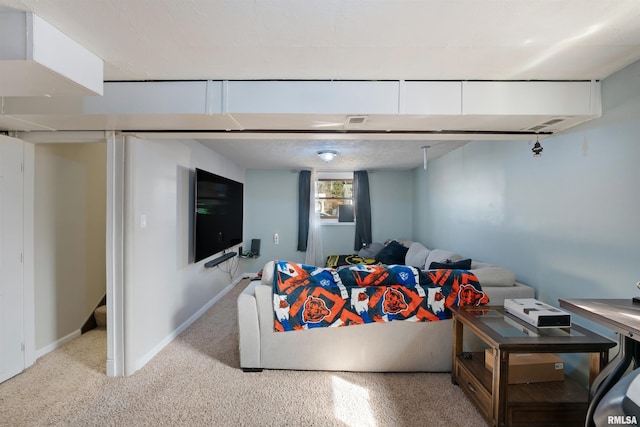 living area featuring speckled floor and baseboards