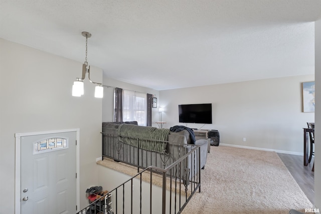 living area featuring baseboards