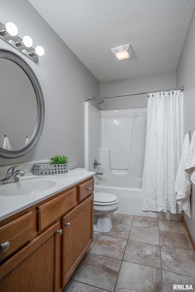 full bath featuring visible vents, toilet, a textured ceiling, shower / tub combo, and vanity