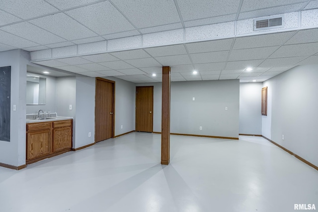 finished below grade area with a sink, visible vents, baseboards, and recessed lighting