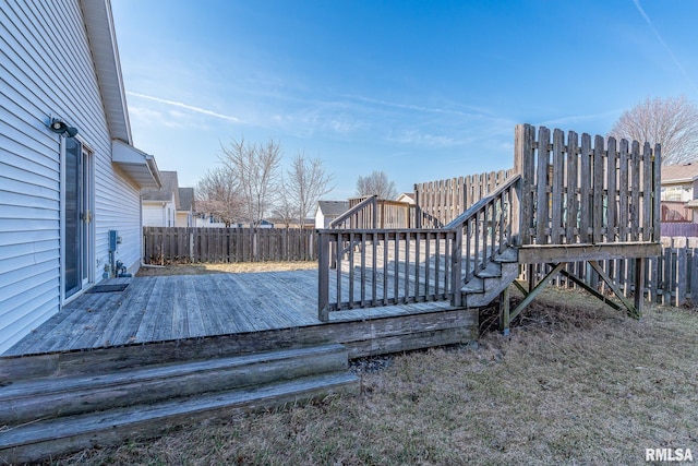 wooden terrace featuring fence