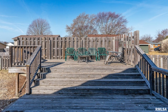 wooden deck featuring fence