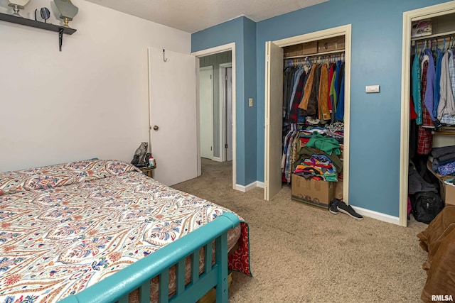 bedroom with baseboards and carpet flooring