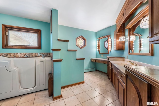 bathroom featuring tile patterned flooring, baseboards, baseboard heating, a bath, and vanity