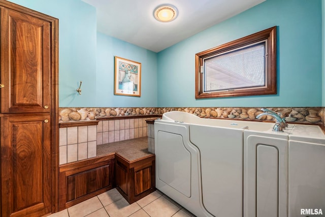 laundry room with light tile patterned flooring