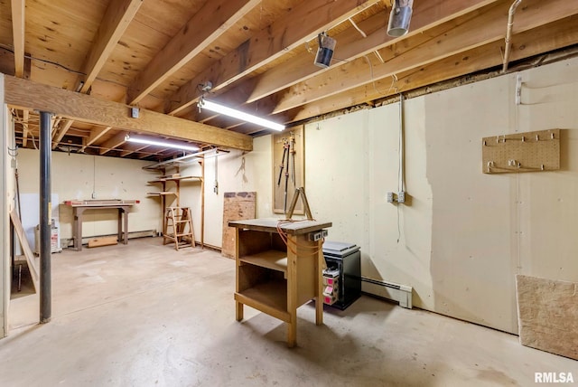 unfinished basement with a baseboard heating unit