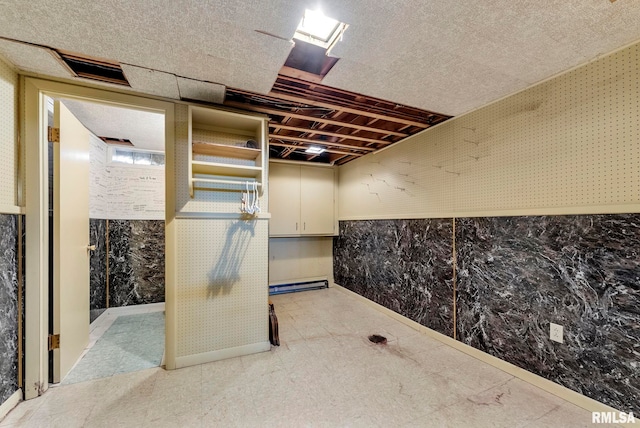 unfinished basement with visible vents and wallpapered walls