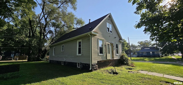 view of property exterior featuring a lawn