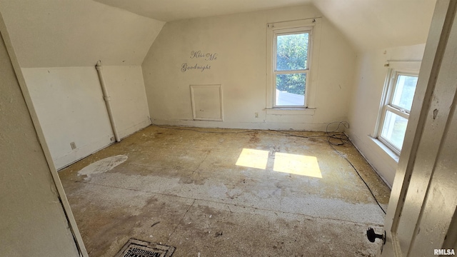 additional living space with vaulted ceiling