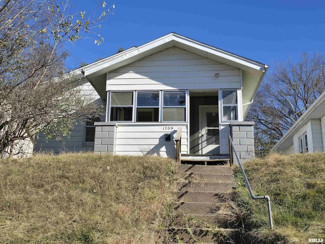 view of front facade featuring a sunroom