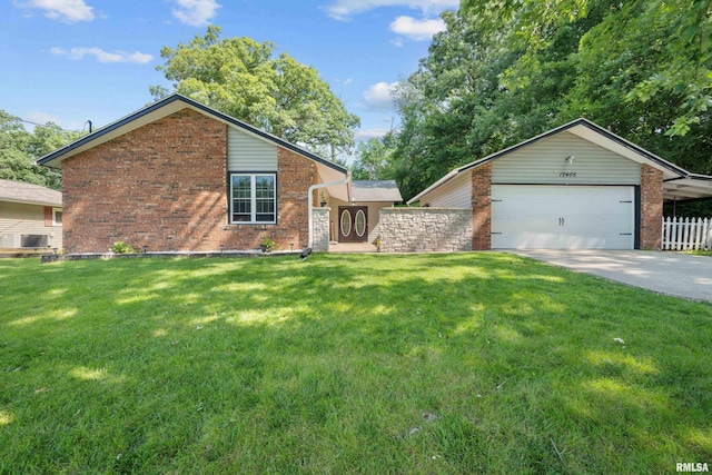 mid-century inspired home featuring a front yard, fence, driveway, an attached garage, and brick siding