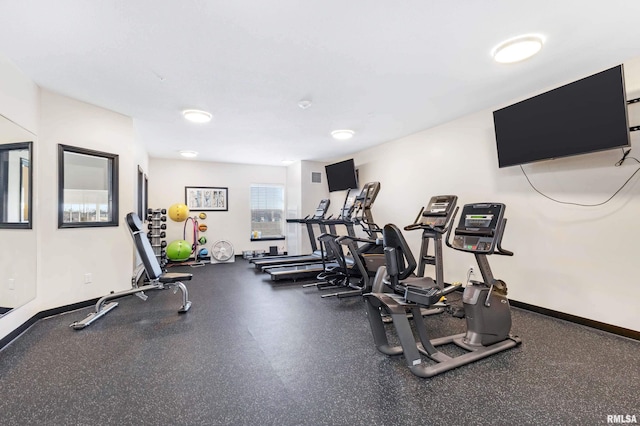 workout area featuring baseboards