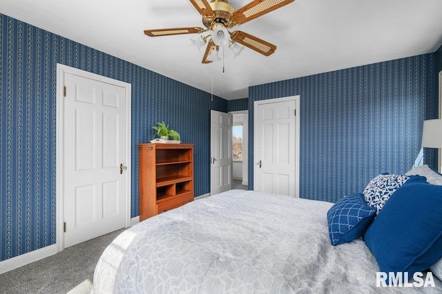 carpeted bedroom with wallpapered walls, baseboards, and ceiling fan