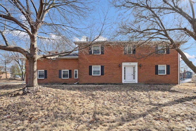 view of front of house with brick siding