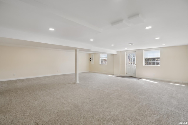 below grade area featuring recessed lighting, baseboards, and carpet