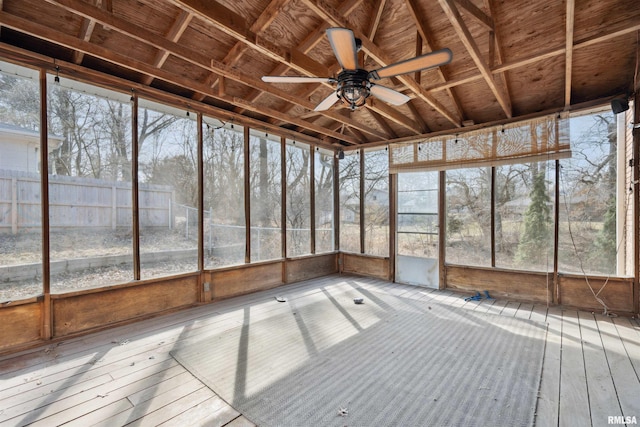 unfurnished sunroom featuring a ceiling fan