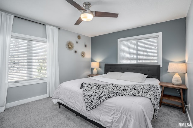 bedroom with baseboards, carpet, and a ceiling fan