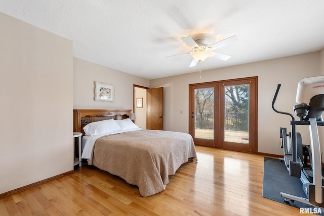 bedroom with a ceiling fan, baseboards, light wood-style flooring, a textured ceiling, and access to outside