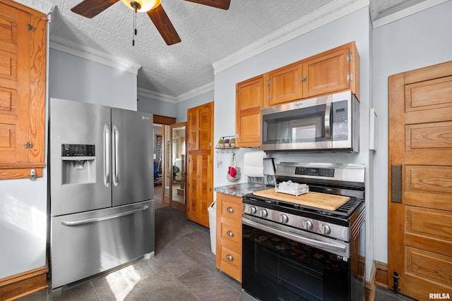 kitchen with stainless steel appliances, a ceiling fan, ornamental molding, and brown cabinetry