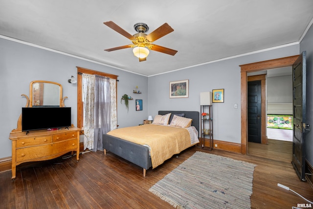 bedroom with baseboards, wood finished floors, a ceiling fan, and ornamental molding