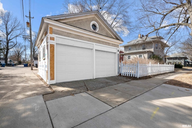 garage featuring fence