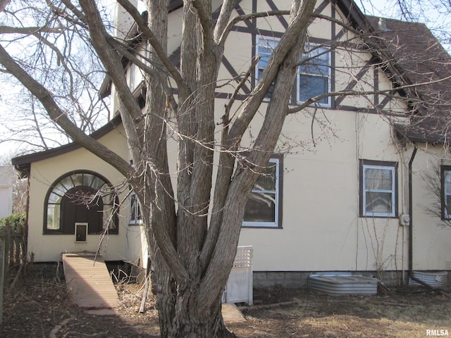 view of side of property with stucco siding