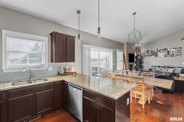 kitchen featuring visible vents, a sink, open floor plan, dishwasher, and dark wood-style flooring