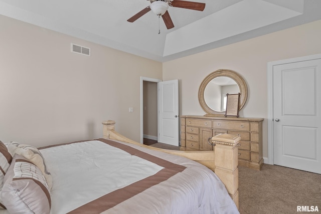 bedroom with a ceiling fan, light colored carpet, visible vents, and baseboards