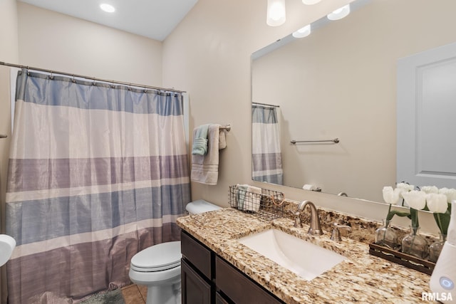 bathroom featuring vanity, tile patterned floors, toilet, and a shower with curtain