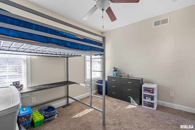 bedroom featuring visible vents, ceiling fan, baseboards, and carpet