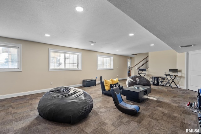 interior space with visible vents, baseboards, carpet flooring, recessed lighting, and a textured ceiling