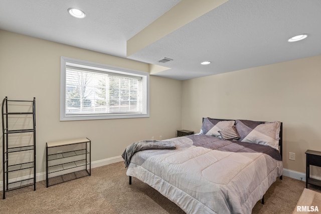 carpeted bedroom with recessed lighting, visible vents, and baseboards