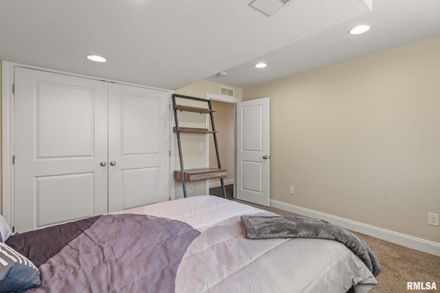 bedroom with visible vents, baseboards, and carpet