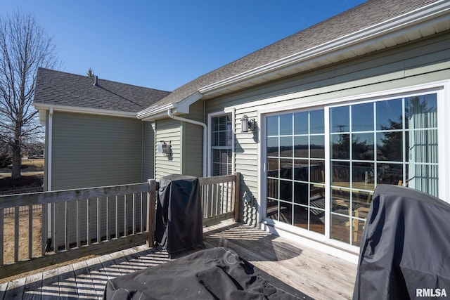 wooden deck featuring area for grilling