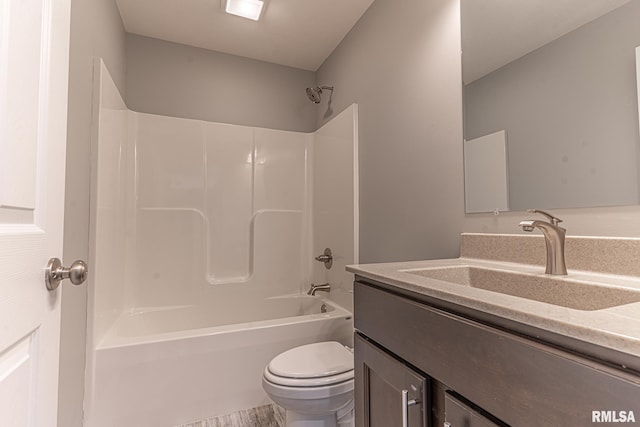 full bath featuring toilet, vanity, and shower / tub combination