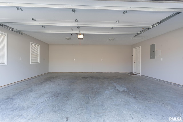 garage featuring electric panel and a garage door opener