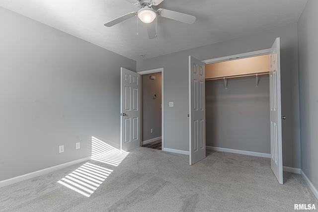 unfurnished bedroom with a closet, a ceiling fan, baseboards, and carpet floors